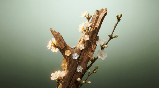 Flower Charm Bracelet displayed with floral accents on a decorative wooden branch.