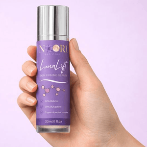 Luna Lift Facial Serum in a hand, showcasing its skin-firming properties and halal certification.