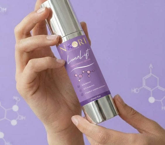 Person holding Luna Lift Facial Serum bottle against a purple background with molecular graphics.